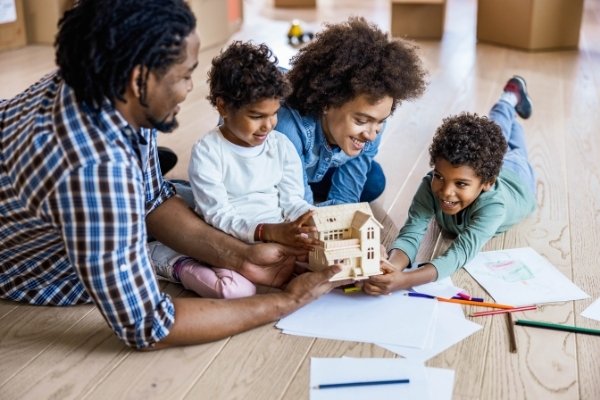 family with toy house